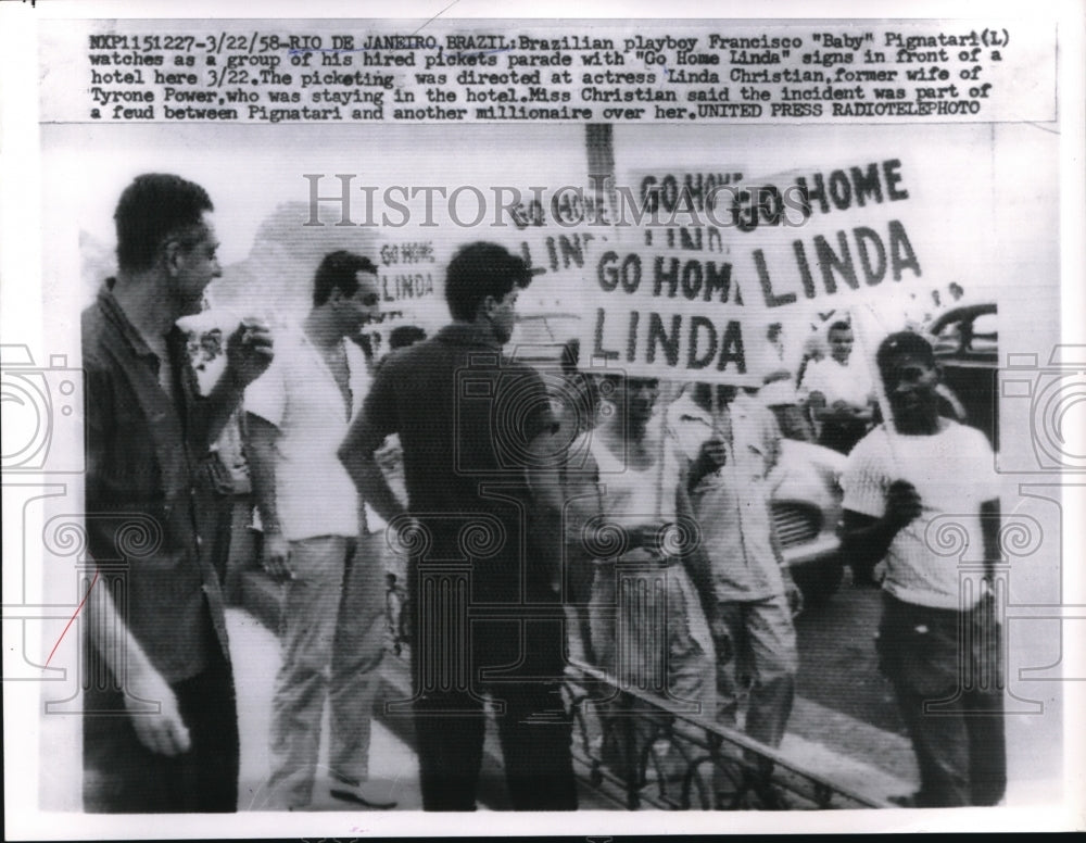 1958 Press Photo Brazilian playboy Francisco "Baby" Pignatari in front of picket