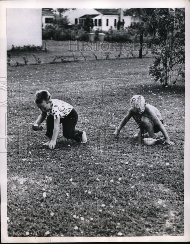 1951 Press Photo Two Youngsters Collecting Hailstones after Hailstorm in Miami,