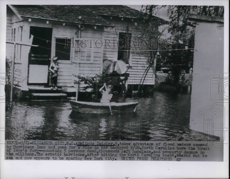 Load image into Gallery viewer, 1955 Press Photo Melinda Zeigler in flood waters caused by Hurricane Ione
