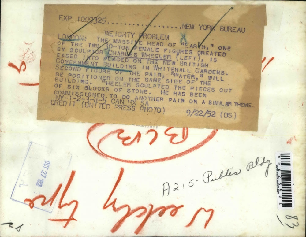 1952 Press Photo Charles Wheeler places massive head on government building