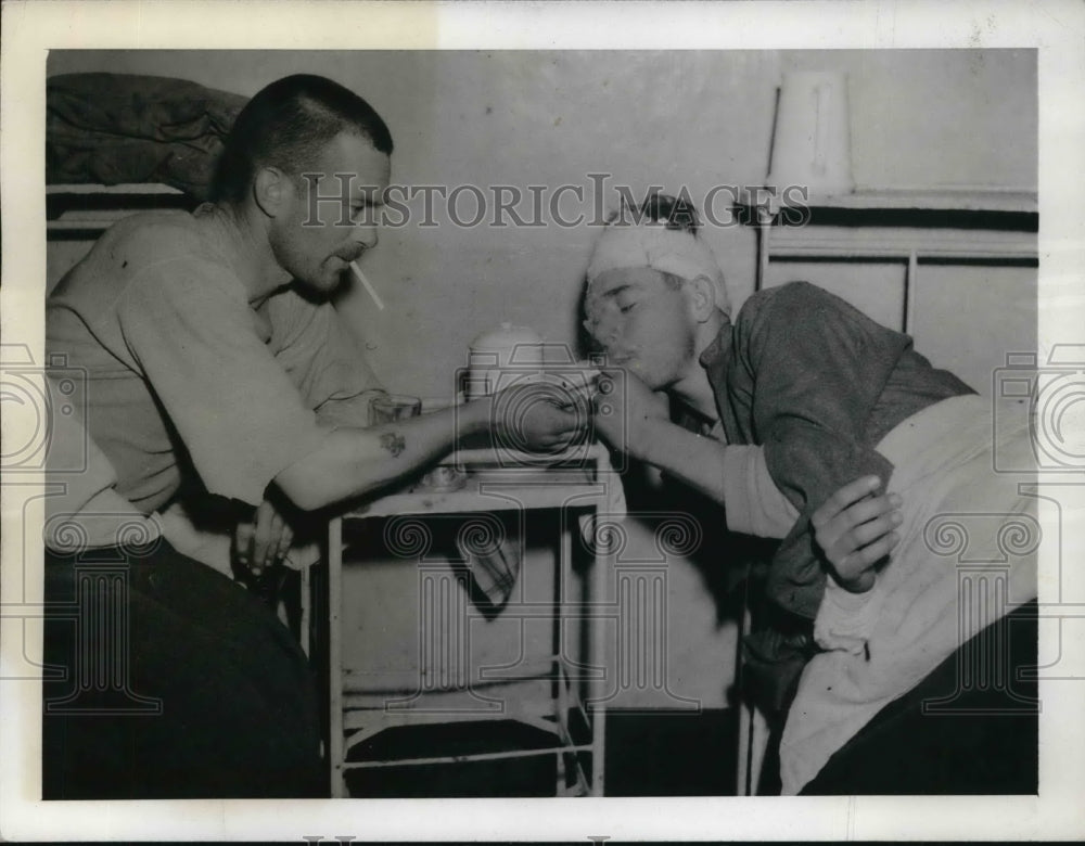 1943 Press Photo Private Buell Howard Offers A Light To Private John Hendricks