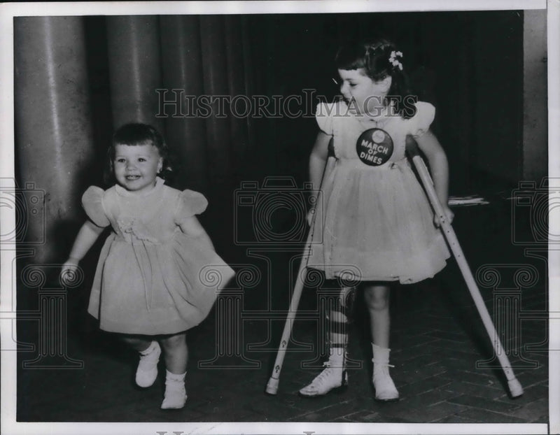 Load image into Gallery viewer, 1956 Press Photo Marlene Olsen Walks With Her Sister Karen
