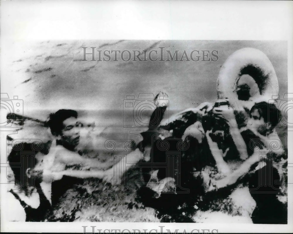 1967 Press Photo Unidentified man being pulled out of a lake