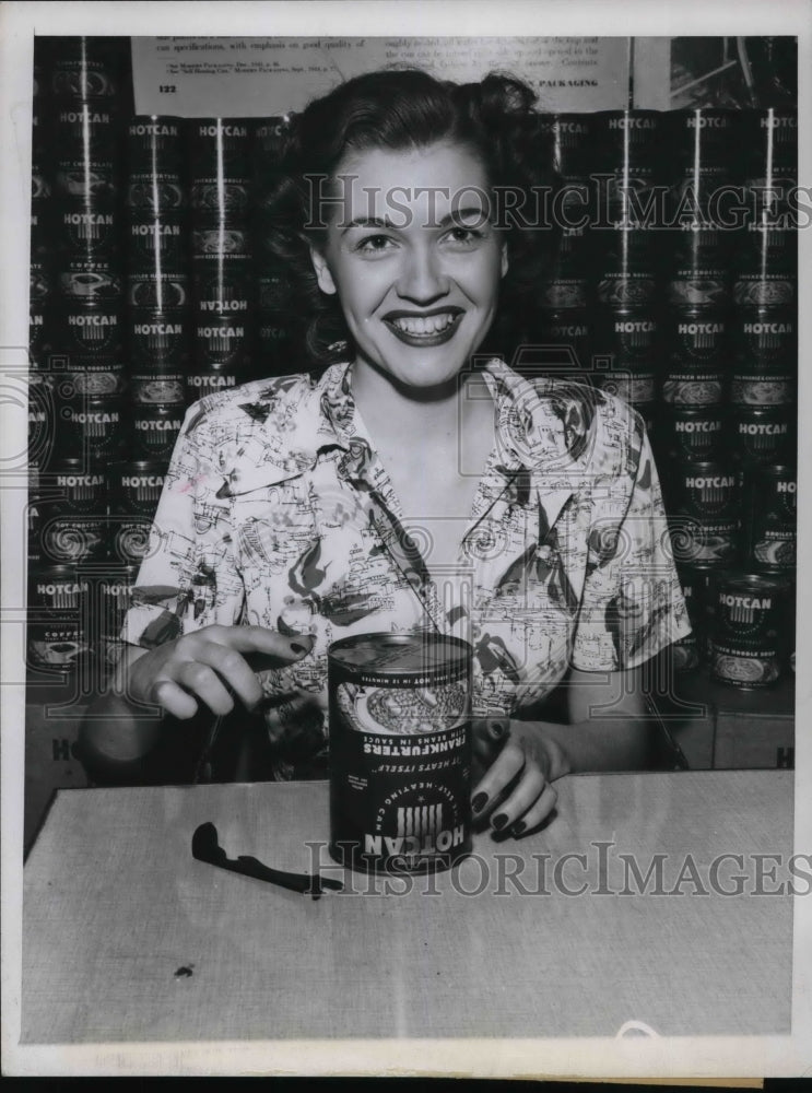 1948 Press Photo Nanette Taigs demonstrating a new self heating can at the