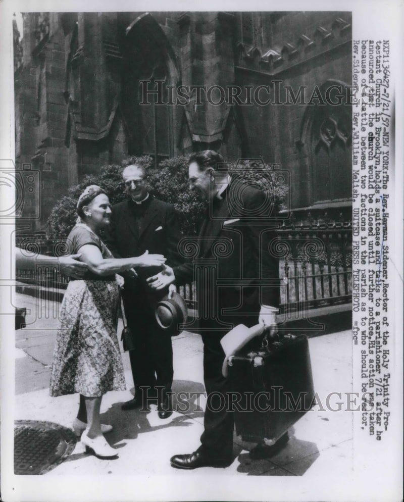 Load image into Gallery viewer, 1957 Press Photo Herman Sidener talks to parishioner after closing church
