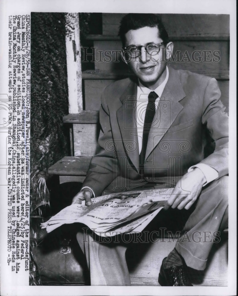 Load image into Gallery viewer, 1956 Press Photo John B. Powell Studies Local Newspaper AfterBeing Indicted

