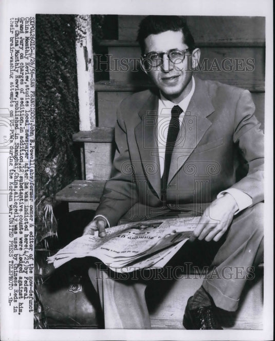 1956 Press Photo John B. Powell Studies Local Newspaper AfterBeing Indicted
