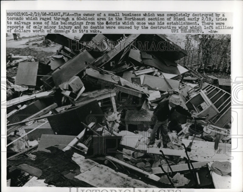 Load image into Gallery viewer, 1968 Press Photo Owner of a small business after tornado hits Miami, Florida

