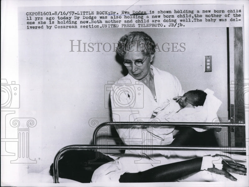 Load image into Gallery viewer, 1957 Press Photo Dr. Eva Dodge holding baby delivered by Cesarean section
