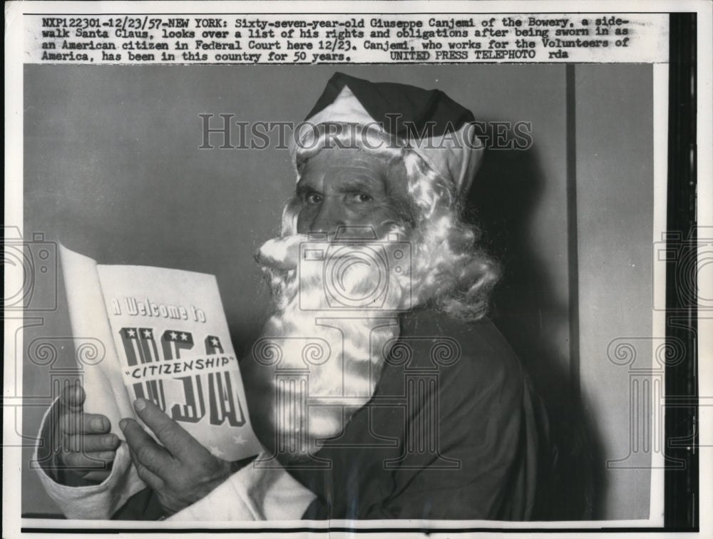 1957 Press Photo Giuseppe Canjoni Looking Over List of Rights As A Citizen