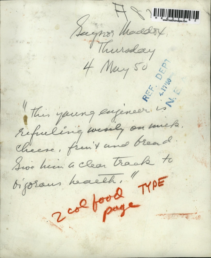 1950 Press Photo Gaynor Maddox a young engineer is refueling wisely on Milk,