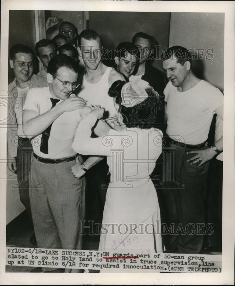 Load image into Gallery viewer, 1948 Press Photo UN Guards stand in line at the nurse station to get shots for

