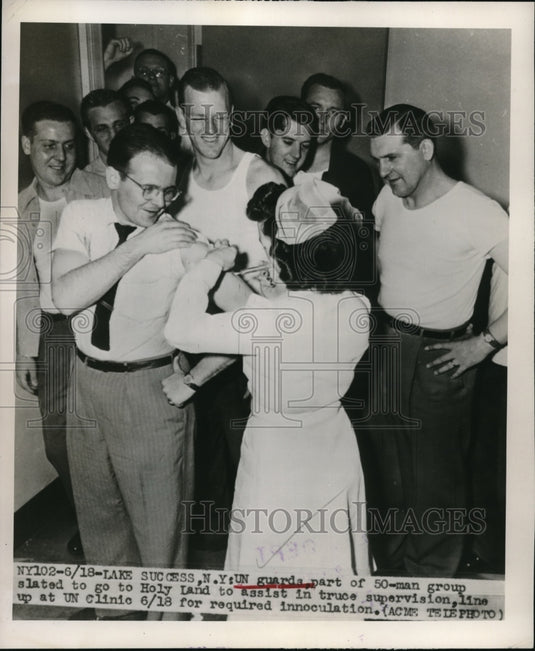 1948 Press Photo UN Guards stand in line at the nurse station to get shots for