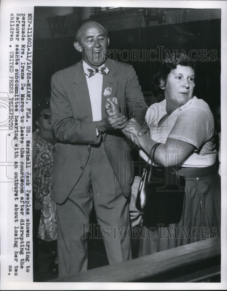 1955 Press Photo Jack Peoples Trying To Persuade Mrs. Irene De Marco