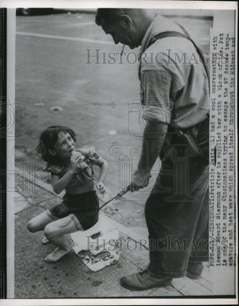 1953 Press Photo Patricia Davis having conversation with iceman Edward Siemonn