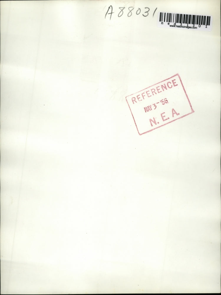 1956 Press Photo Mrs John G Dixon cleaning up debris of wedding gift bomb