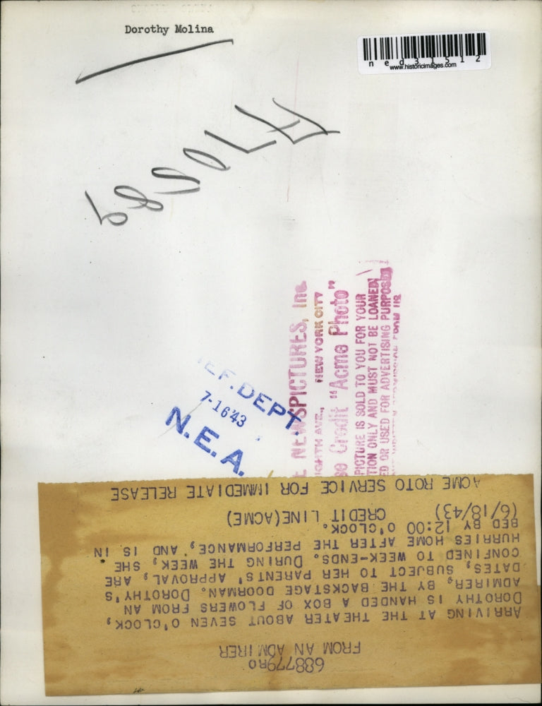 1943 Press Photo Dorothy is handed box of flowers left by admirer by backstage