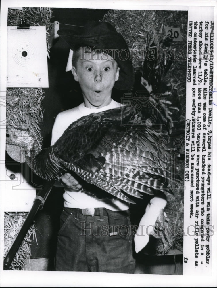 Load image into Gallery viewer, 1957 Press Photo Detroit Mike Doelle hopes his dead eye will win this gobbler
