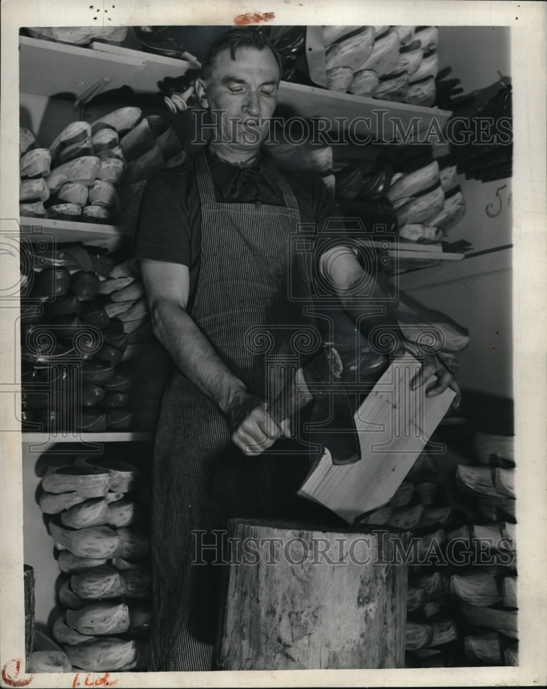 1937 Press Photo Next Vrombaut chops a block of willow wood to the shape desired