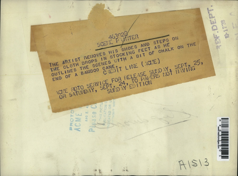 1938 Press Photo Artist removes shoes and steps on cloth drops as he outlines