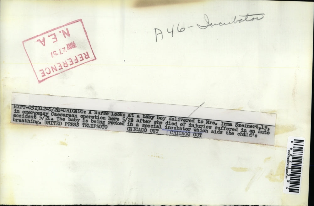 1957 Press Photo Chicago a nurse looks at baby boy delivered to Mrs Irma Szeinar