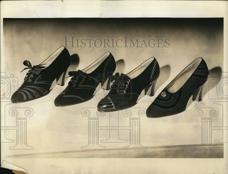 Load image into Gallery viewer, 1934 Press Photo the days of spike heels seem about numbered for street wear
