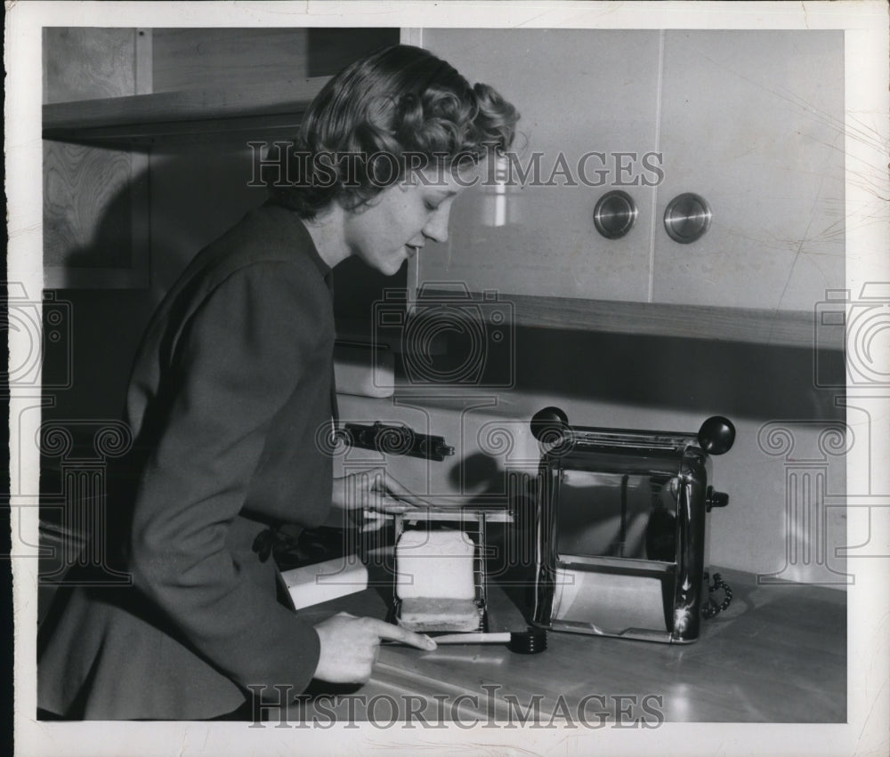 1949 Press Photo Woman Uses Kitchen Appliances
