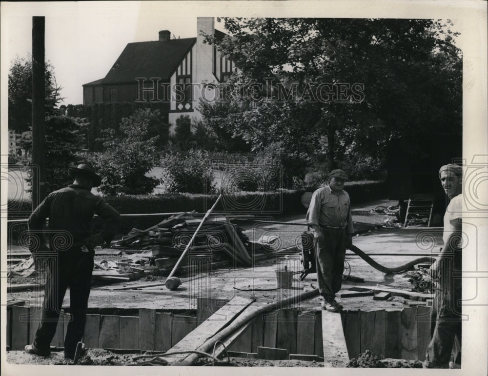 1949 Press Photo Men working on a sewer