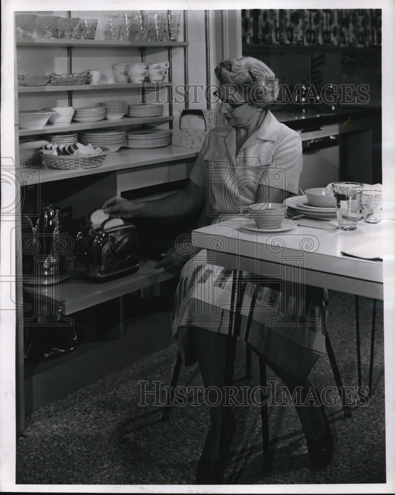 1956 Press Photo Dish cabinet is conveniently located for setting table and