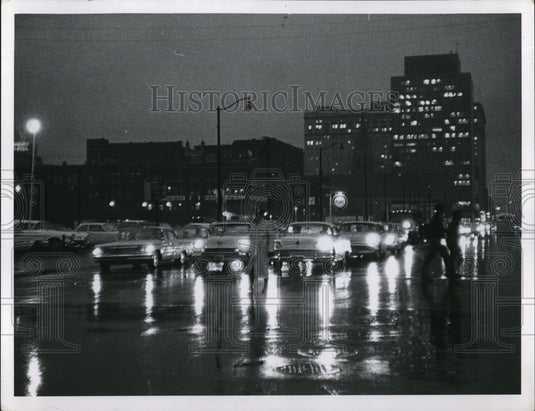 1963 Press Photo Darkness sets in on a rainy day lights in office building are