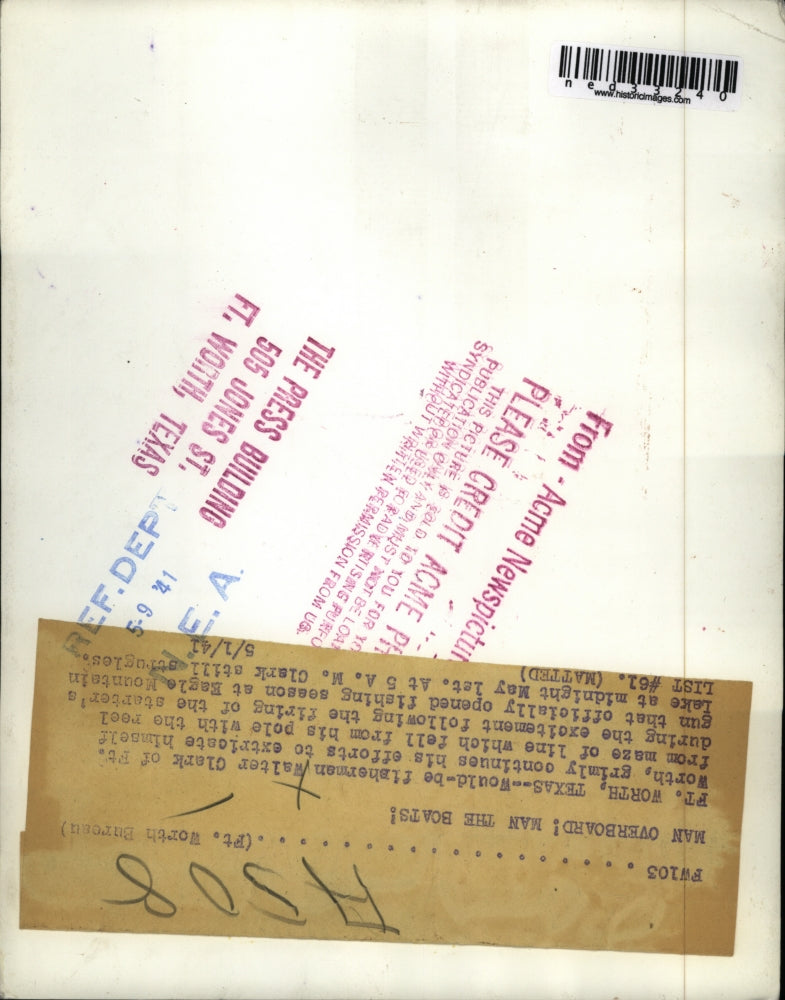 1941 Press Photo Fisherman Walter Clark fixing his reel