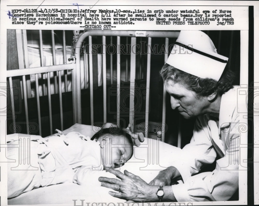 1958 Press Photo Jeffrey Mankus lies in crib as Genevieve Herschman watches