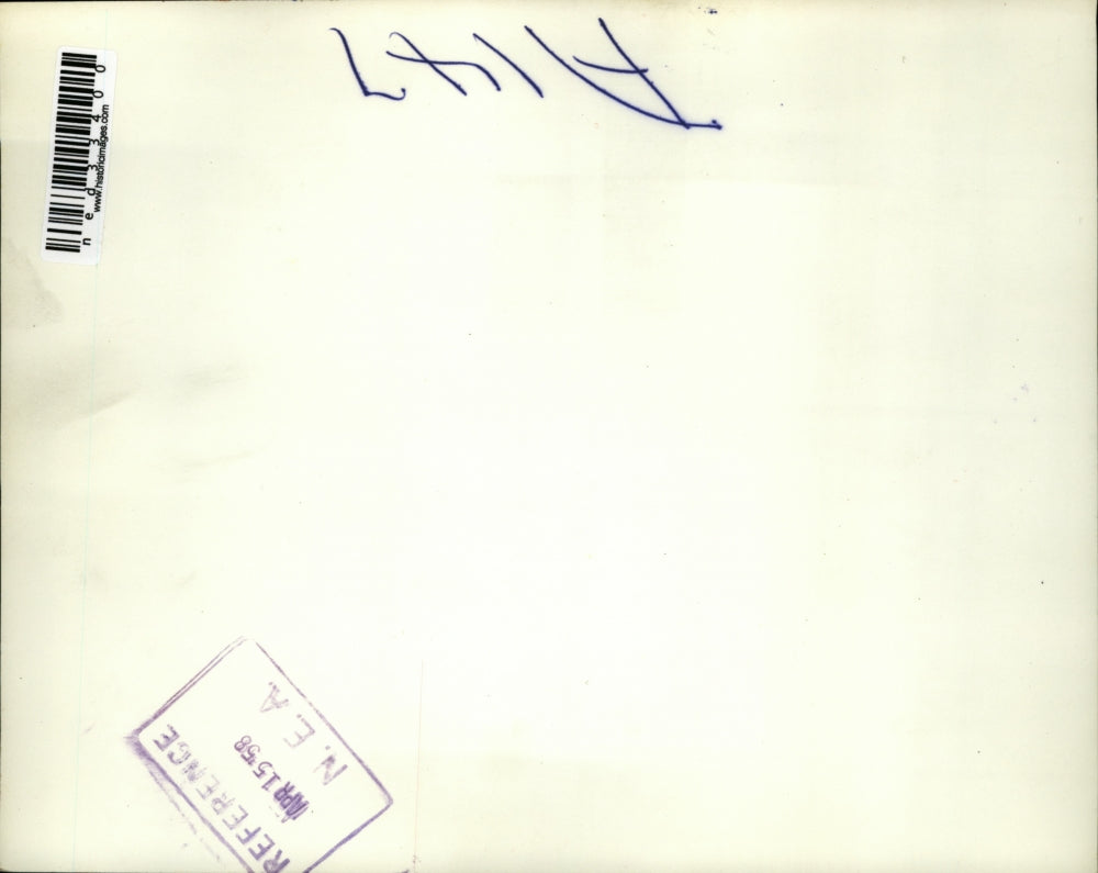 1958 Press Photo Jeffrey Mankus lies in crib as Genevieve Herschman watches