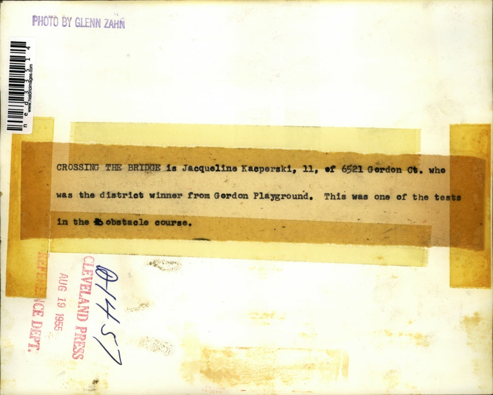 1955 Press Photo Jacqueline Kaeperski crossing obstacle course on her bicycle