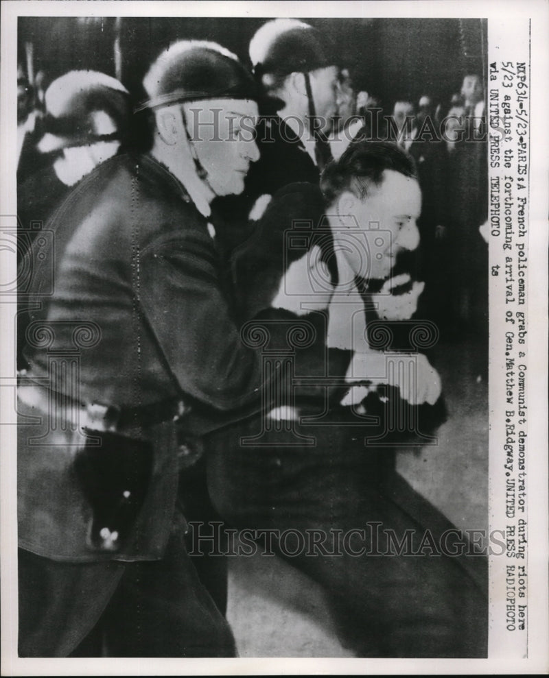 Load image into Gallery viewer, 1952 Press Photo French policeman grabs Communist demonstrator during riot
