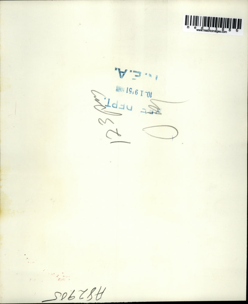 1951 Press Photo Edwin Furtado being led to US Commissioner's office