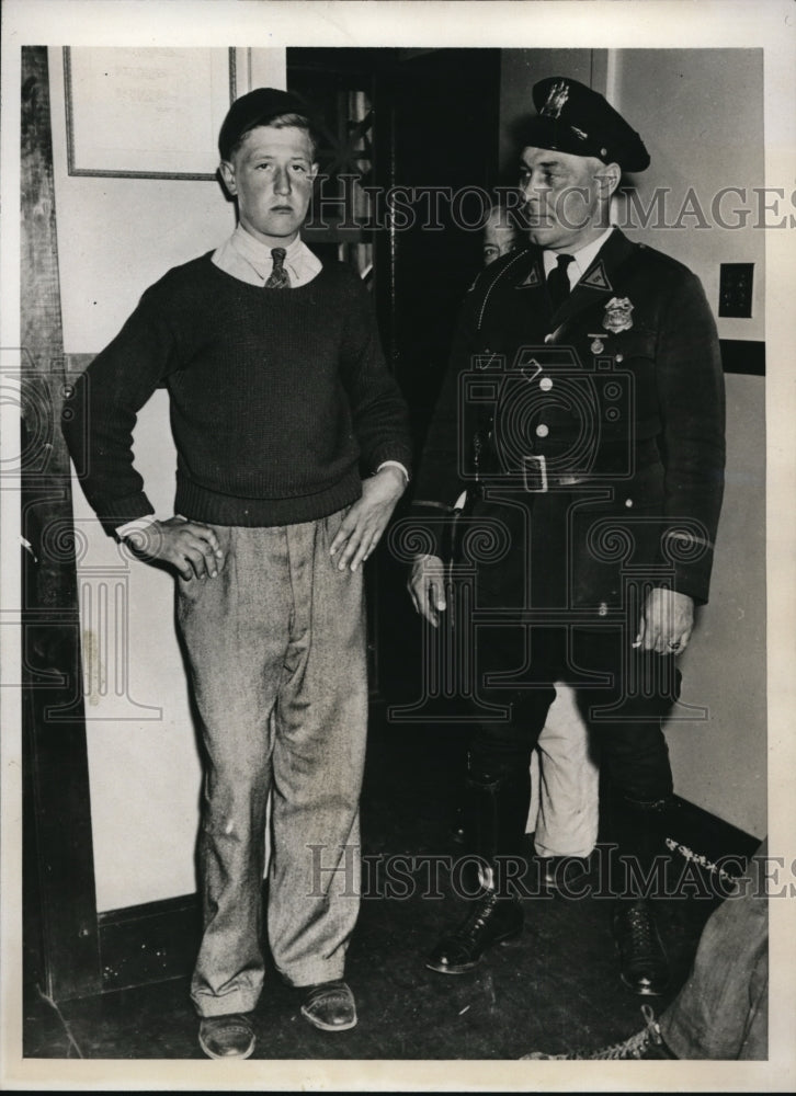 1938 Press Photo August Bauer, Jr. with policeman in police headquarters