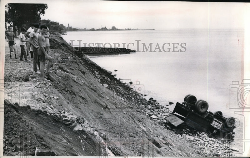 Load image into Gallery viewer, Undated Press Photo truck overturned and down hill into water
