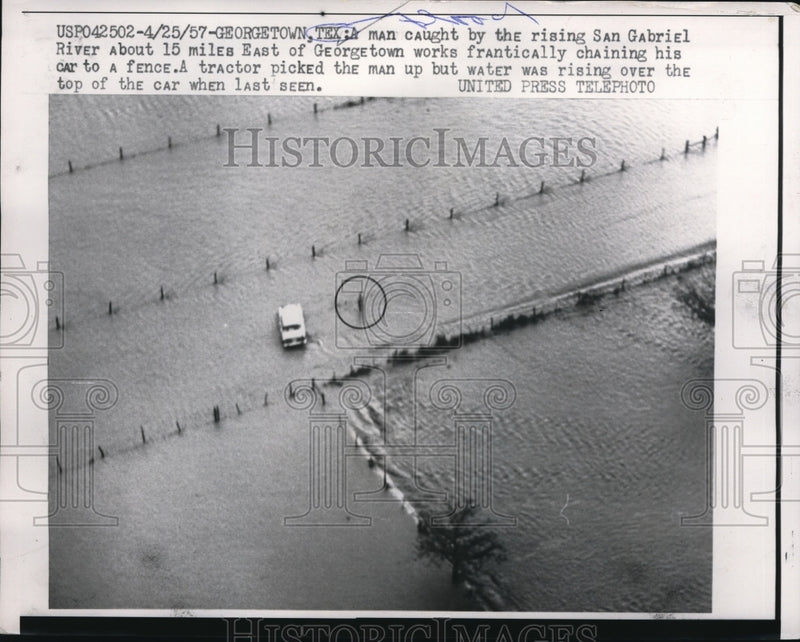 Load image into Gallery viewer, 1957 Press Photo Man caught by the rising San Gabriel Rivers in Texas.
