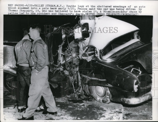 1957 Press Photo Youths look at shattered wreckage of auto that slams into pole