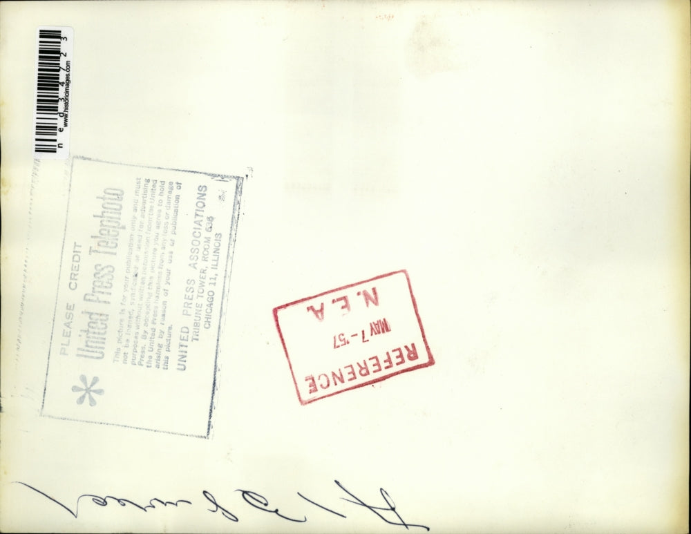 1957 Press Photo Youths look at shattered wreckage of auto that slams into pole