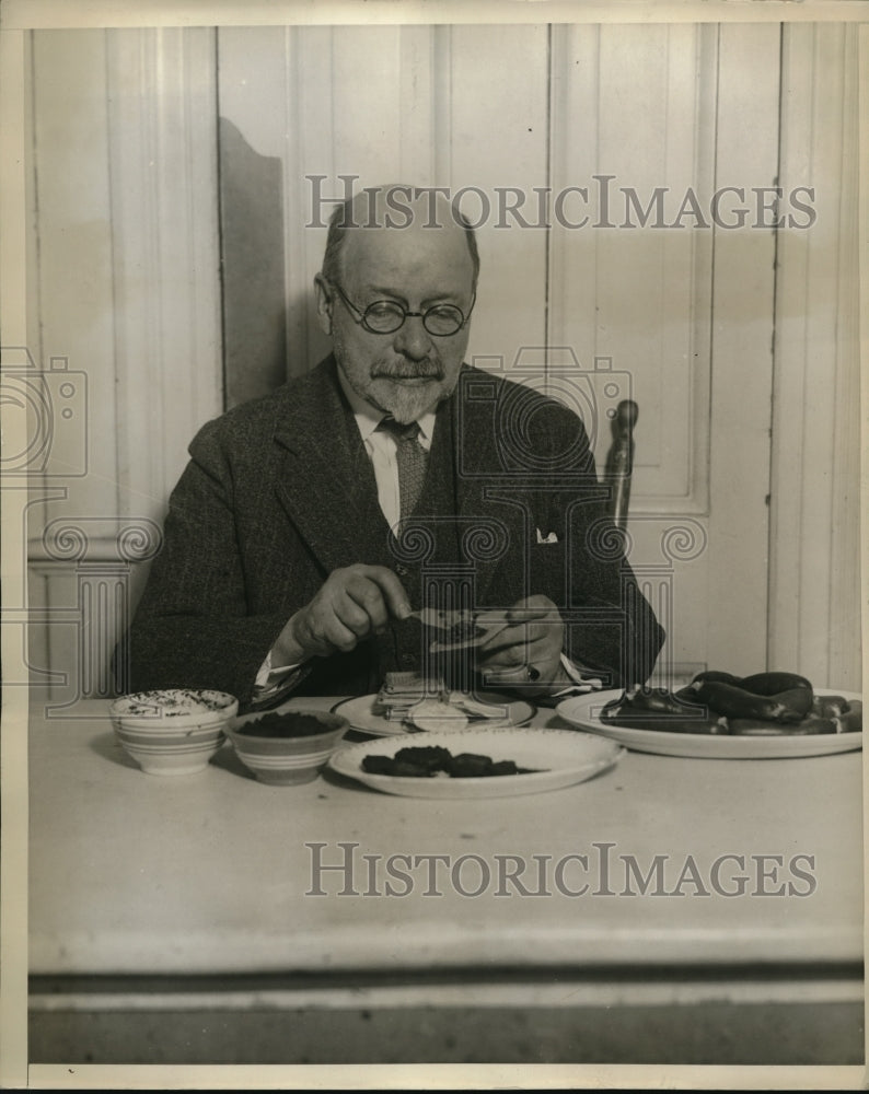 Load image into Gallery viewer, 1937 Press Photo Dr. Wesson Makes A Sandwich Of His Prepared "Wessona"
