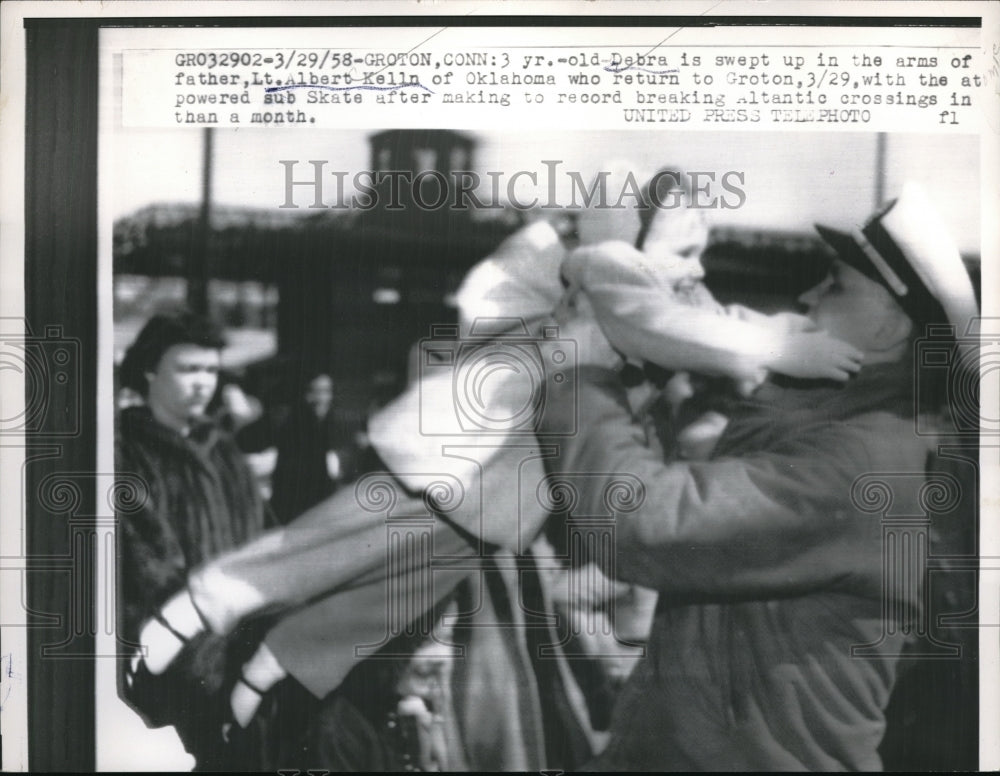 1958 Press Photo Debra Kelln Is Swept Up By Father, Lt. Albert Kelln