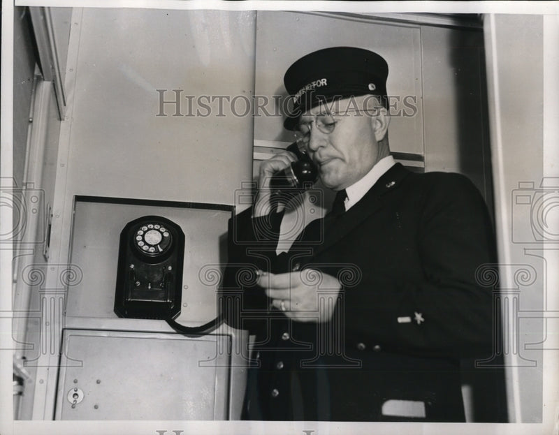 Load image into Gallery viewer, 1938 Press Photo Conductor RC Eyerly uses crew phone to give orders to start
