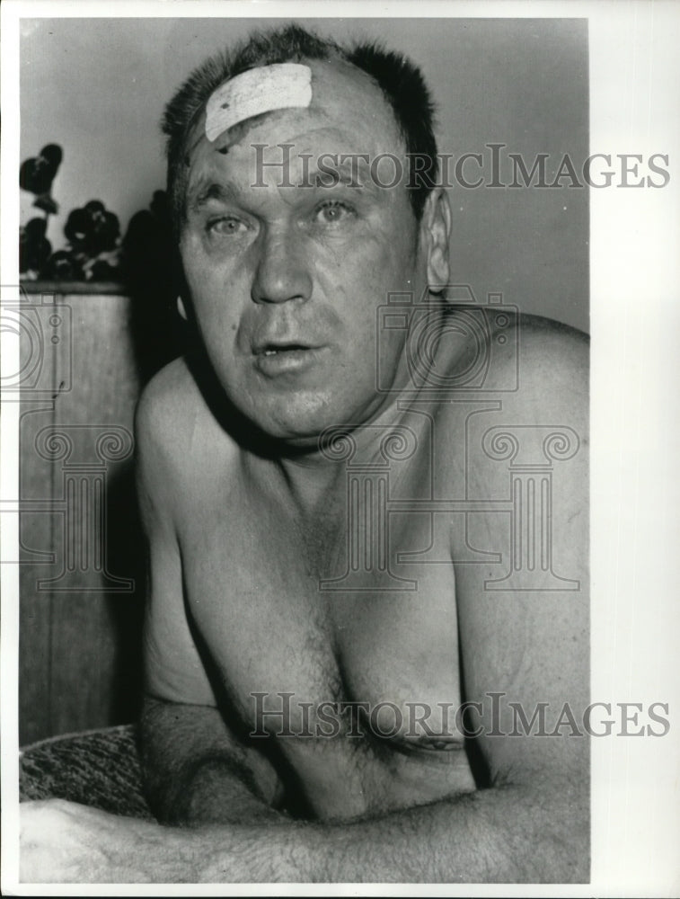 Load image into Gallery viewer, 1963 Press Photo Matt Rauhala Appears Dazed After Going Thru Plywood

