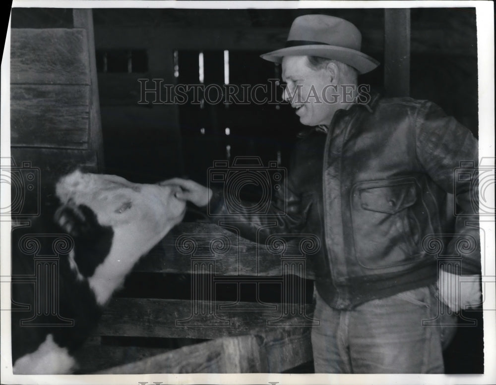 1957 Press Photo Farmer in the Dark