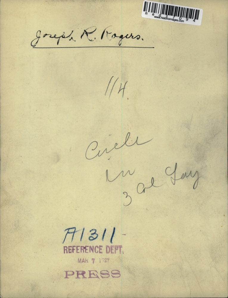 1927 Press Photo Joseph Rogers posed at the entrance of a building