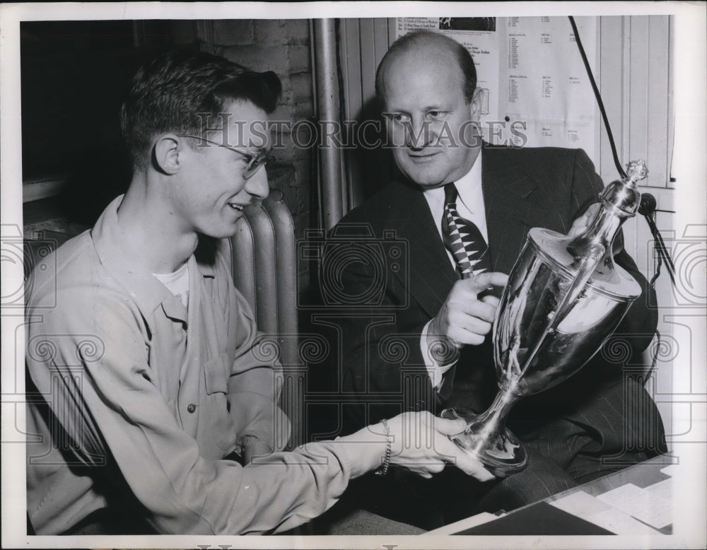 1949 Press Photo Track Coach Guy Sundt right and Don Gehrmann talk about the cup- Historic Images