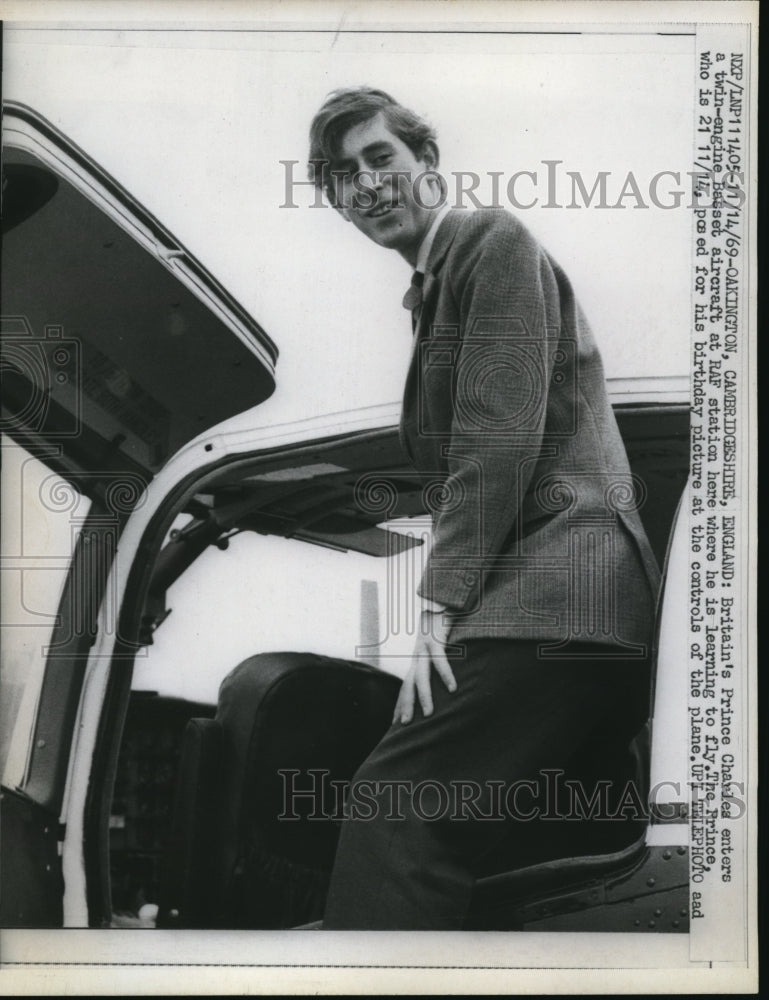 Load image into Gallery viewer, 1969 Press Photo Prince Charles enters a twin-engine Basset aircraft

