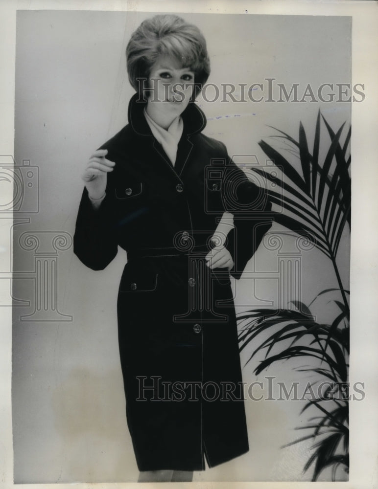 1963 Press Photo Woman Models Cyclone Raincoat in Paris - ned37763